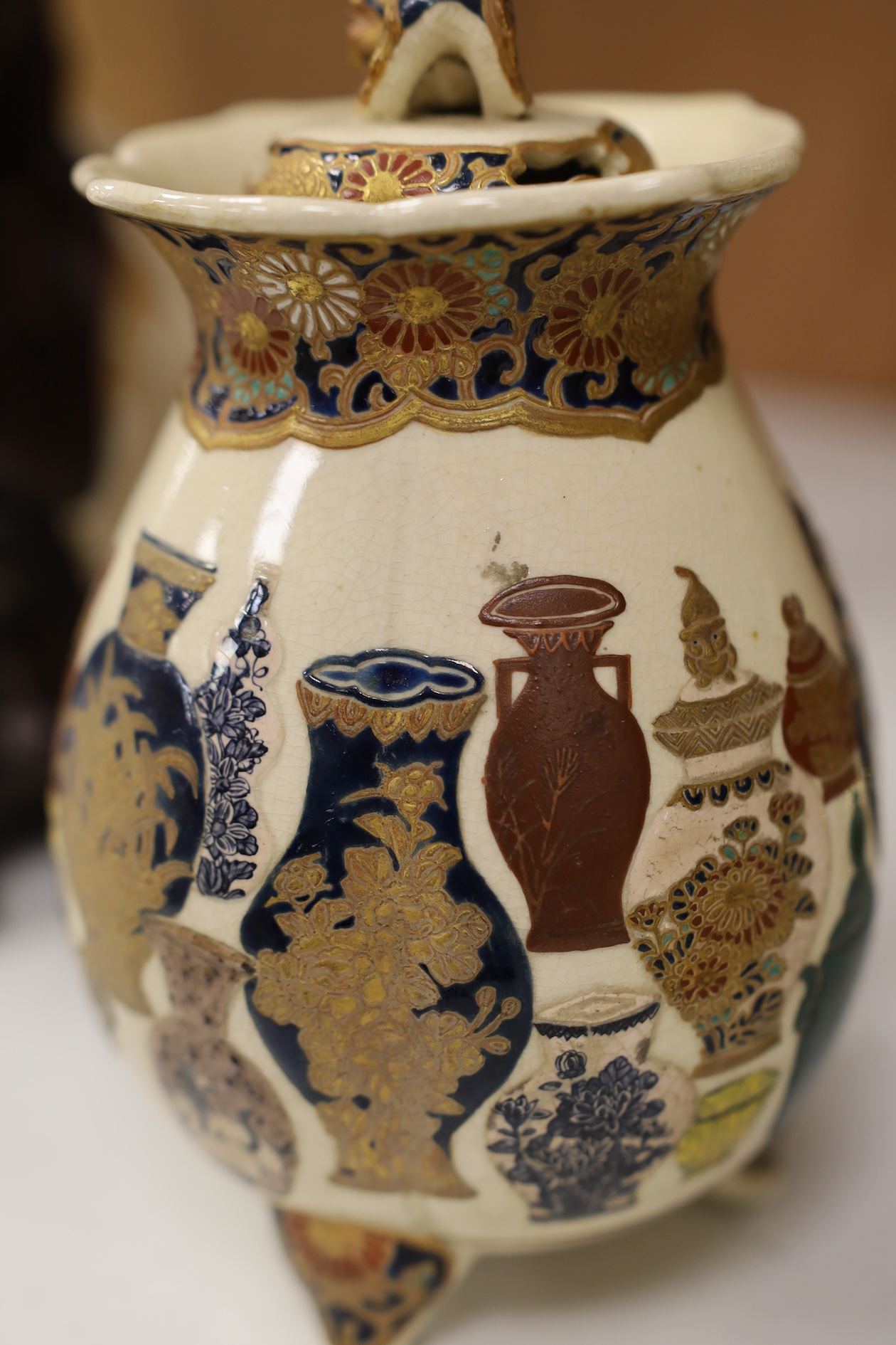 A late 19th century Japanese Satsuma ‘hundred antiques’ gosu blue pot pourri vase and three later items of Satsuma, including a bowl and cover a bowl on stand, a box and cover, tallest 18.5cm high. Condition - vase cover